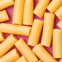 Overhead view of hollow dried pasta tubes made from durum wheat dough for use as an ingredient in Italian and Mediterranean cuisine