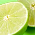 Close up view of fresh halved limes with their thin rind and tangy acidic pulp rich in vatamin c used as a flavouring in cooking