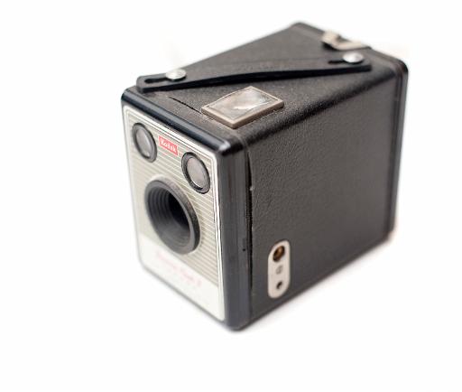 Old vinatge box camera on a white background, high angle view with shallow dof