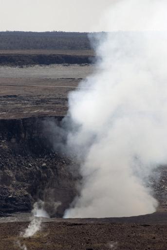 geothermal hot volcanic gasses escape from steam vents in the Halemaumau crater